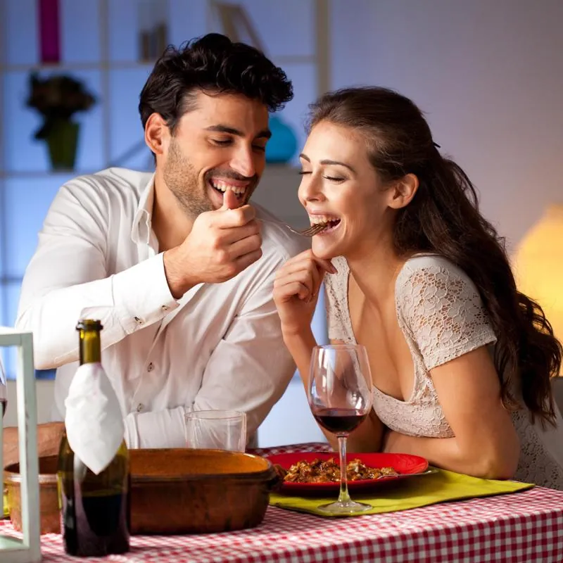 Couple laughing at dinner